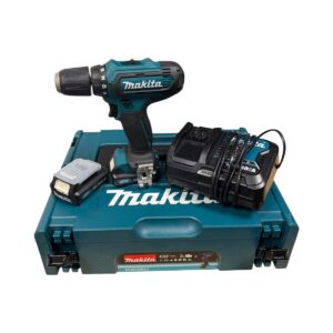 Cordless Makita drill with teal case, drill bits, and charger shown on a teal Makita toolbox case (power toolkit)