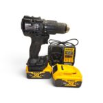 DeWalt cordless drill with two 18V XR batteries and charger on white background