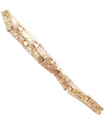 Gold-tone bracelet with decorative filigree openwork links and rectangular connectors.