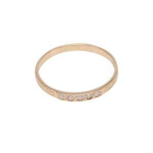 Gold ring with five small diamonds along the band on a plain white background.