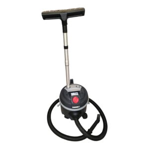 Upright floor cleaning machine with a long metal stem, T-shaped handle, and a circular base with hoses attached (LAVOR brand).