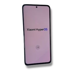 Phone tilted left showing Xiaomi HyperOS startup screen with a circular arrow button at the bottom.
