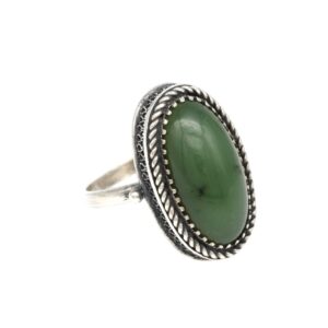 Oval green gemstone ring with a silver rope-edged bezel, vintage style jewelry