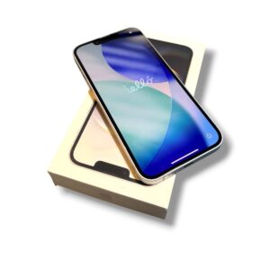 Modern smartphone resting diagonally on its box, screen showing a colorful wallpaper.