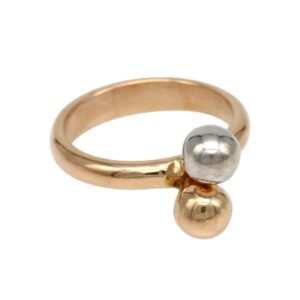 Gold ring with a two-bead design, featuring a silver ball and a gold ball at the front.