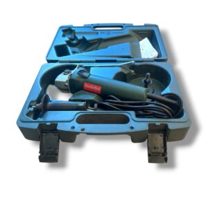 Metabo angle grinder stored in an open blue carrying case with power cord coiled beside it