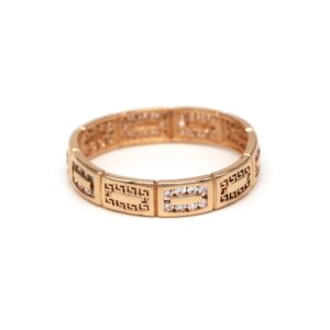 Gold ring with Greek key pattern and diamond accents along the band.