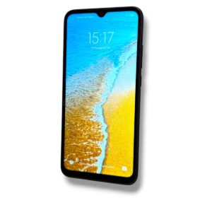 Smartphone tilted left showing a beach wallpaper: blue water meeting yellow sand.