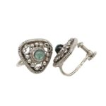 Silver vintage screw-back earrings with a green central gemstone and intricate beaded filigree.