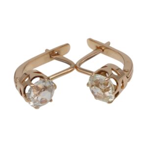 Gold-toned drop-style earrings with large clear faceted stones held in decorative lattice cages on hinged backs