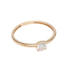 Gold solitaire engagement ring with a round diamond set in four prongs on a slim gold band