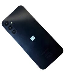 Back of a black Samsung smartphone showing a triple-camera module with a flash next to it.
