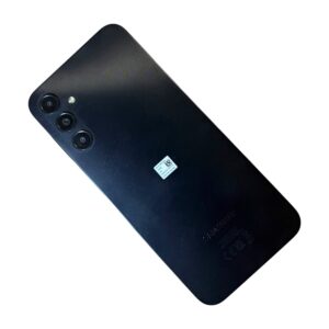 Back of a black Samsung smartphone showing a triple-camera module with a flash next to it.
