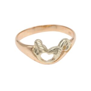 Two-tone ring with a small heart-shaped cutout formed by silver wings on a rose gold band.