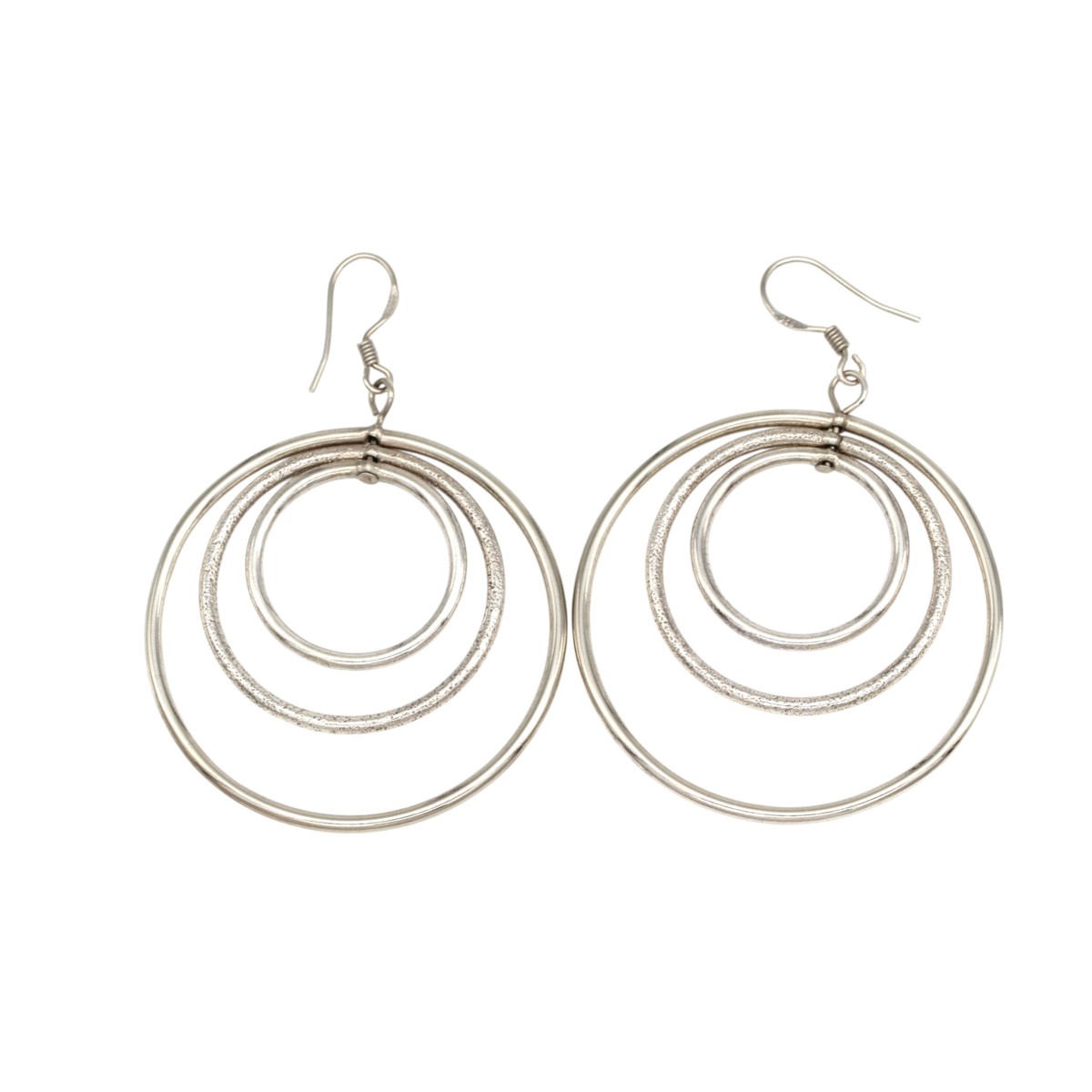 6465fc7d7202ca319624954aa856cee1jpg - Mezola OÜ Silver-tone earrings featuring three concentric hoops in each pair, with hook backs for pierced ears