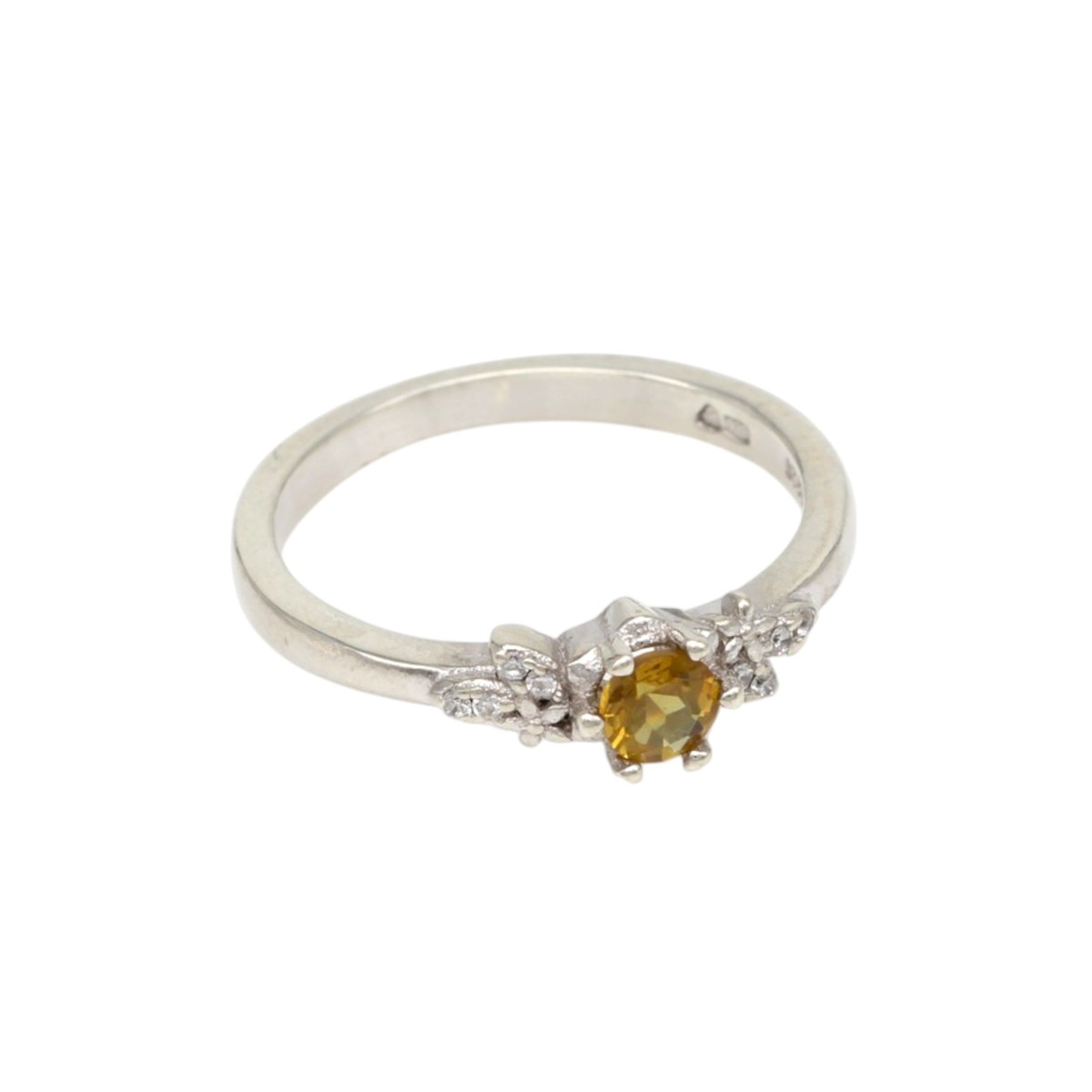 6f2c60f48b25fbc03b44a1ccdafcd9e7jpg - Mezola OÜ Silver ring with a yellow center gemstone and small diamonds on a silver band