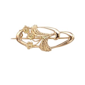 Gold-tone floral brooch with curved vines and small flower accents, pin-back style