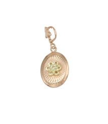 Gold-tone oval locket pendant with a decorative sunburst pattern and a pale flower motif at the center, on a small bail.