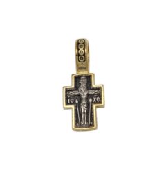 Gold and black crucifix pendant showing Jesus on the cross with a decorative gold border and a square-pattern bail above