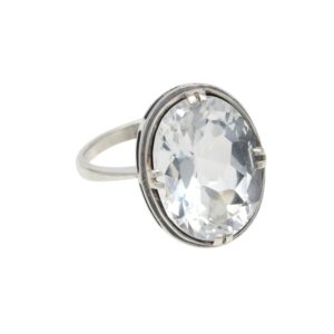 Oval clear gemstone ring with a silver band and prong setting