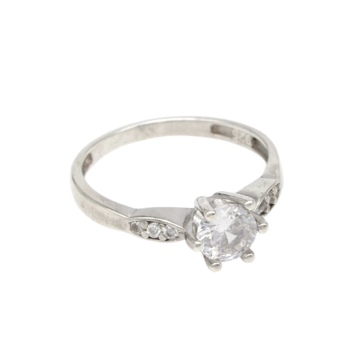 83486a9612b6a45d62f6c21f0633a19fjpg - Mezola OÜ Silver engagement ring with a round center diamond and small side stones on a white background (four-prong setting)