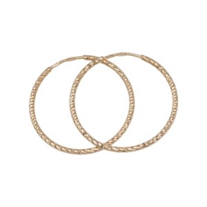 Three gold textured hoop bangles overlapped on a white background