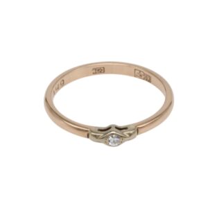 Rose gold ring with a small round diamond set in a delicate bezel on a slim band; inner hallmarks faintly visible on the inside of the band.