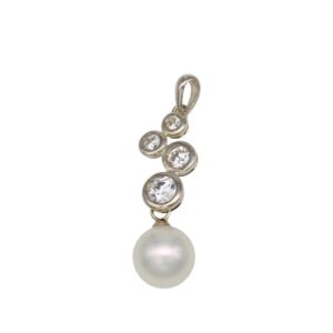 Silver bezel-set pendant with four round diamonds arranged vertically, ending in a large white pearl.