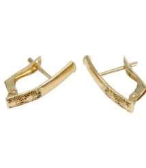 Gold-tone hinged hoop earrings with an engraved sunburst pattern on the front of each hoop