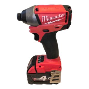Cordless drill/driver: Milwaukee M18 Fuel, red and black body with battery pack attached at the base, right-handed grip