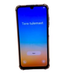 Smartphone with a blue-to-orange gradient lock screen showing the Estonian greeting 'Tere tulemast'.