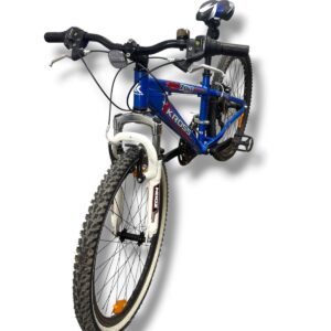 Blue Kross mountain bike with white Zoom front suspension, knobby tires, and a front light, angled from the front-left.