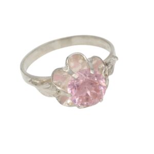 Silver ring with a pink, round gemstone set in a flower-shaped setting with petal accents on a silver band.
