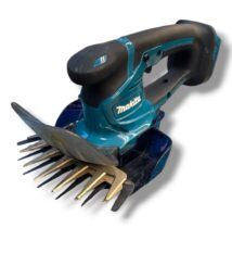 Cordless Makita power tool with a rake-like tine attachment (dethatcher/curved comb) for loosening soil or removing debris.