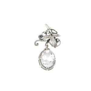 Silver pendant charm with decorative leafy vines and a large faceted crystal drop