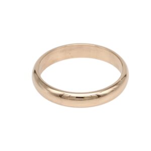 Gold wedding band ring on a white background