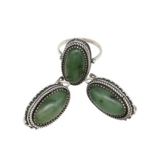 Silver ring and two matching drop earrings, each with oval green stones bordered by twisted rope metalwork.
