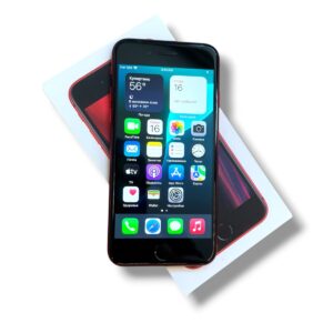 Red-edged iPhone resting on its white box, screen displaying colorful app icons.