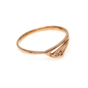 Rose gold ring with a slim band and a tapered triangular setting holding a small diamond at the front
