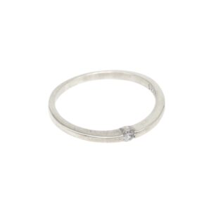 Silver band ring with a small round diamond solitaire on the front edge