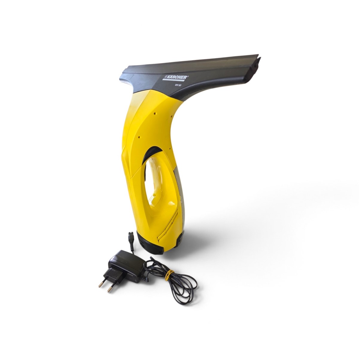 ee5c370cae895265ea0bdff352e74e68jpg - Mezola OÜ Yellow handheld window cleaning tool with squeegee head and black top, branded Kärcher, connected to a charger.