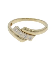 Two-tone gold ring with a curved band and three small diamonds set along a silver-toned plate at the front