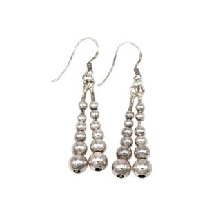 Silver-tone bead drop earrings with three dangling beaded strands on fishhook backs.