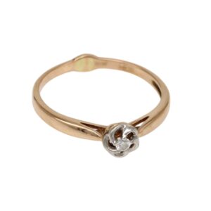 Rose gold ring with a small silver flower setting containing a single diamond