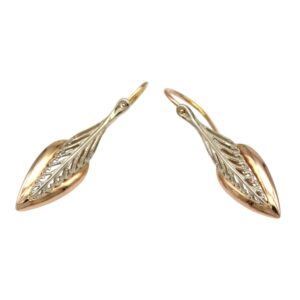 Two-tone leaf-shaped drop earrings with gold hooks and silver filigree detailing on a rose-gold base, wired as harvest-style jewelry.