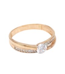 Gold ring with a large round center diamond and small pavé diamonds along the band.