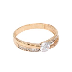 Gold ring with a large round center diamond and small pavé diamonds along the band.