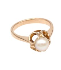 Rose-gold ring with a single white pearl held by petal-like prongs in a floral setting
