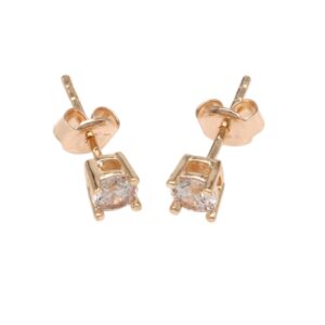 Rose gold stud earrings featuring a single round-cut clear gemstone set in a four-prong square setting.