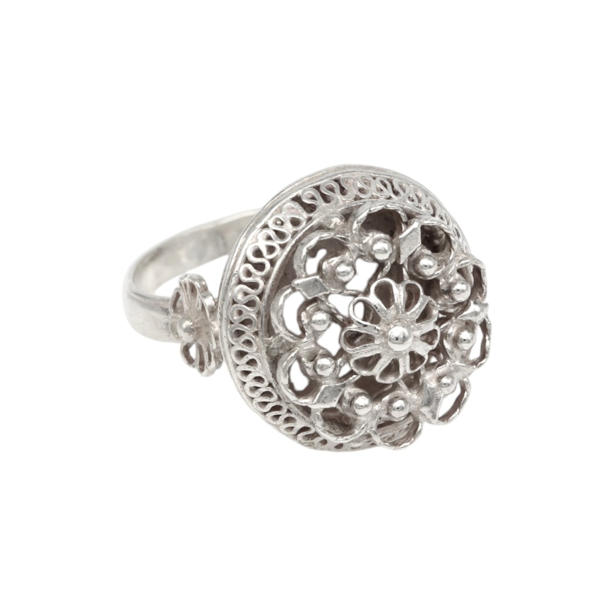 381550c5db8b796e04fa1c8fdd5ce4a4jpg - Mezola OÜ Silver ring with intricate floral filigree and beaded edge, close-up view